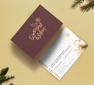 front of business card and back of business cards on table